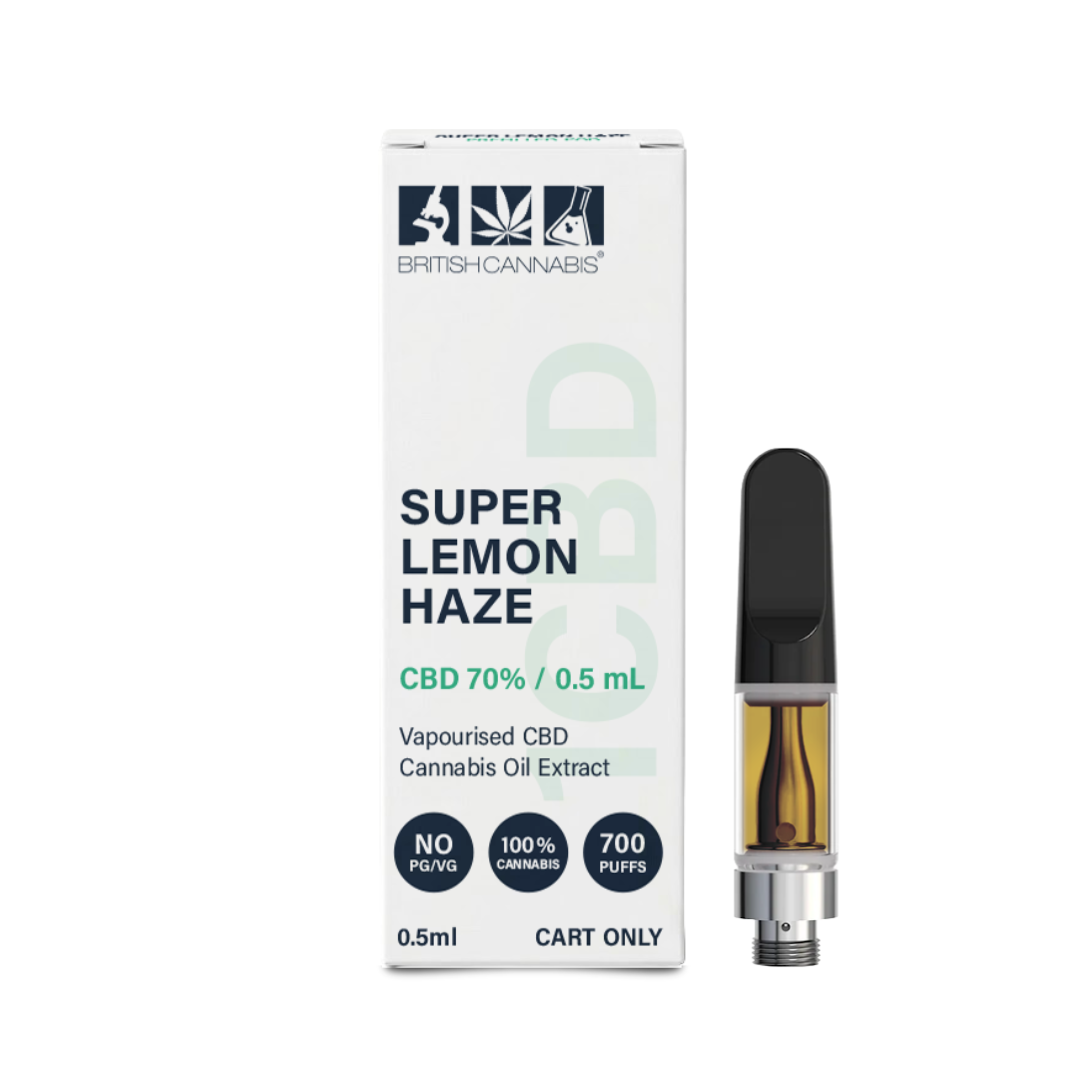 British Cannabis Super Lemon Haze CBD vape cartridge packaging beside the cartridge itself. The white box features navy and mint green branding with the text “SUPER LEMON HAZE”, “CBD 70% / 0.5mL”, and “Vapourised CBD Cannabis Oil Extract”. Additional icons state “NO PG/VG”, “100% Cannabis”, and “700 Puffs”. The vape cartridge has a black mouthpiece, clear chamber with amber oil, and silver screw-thread base.